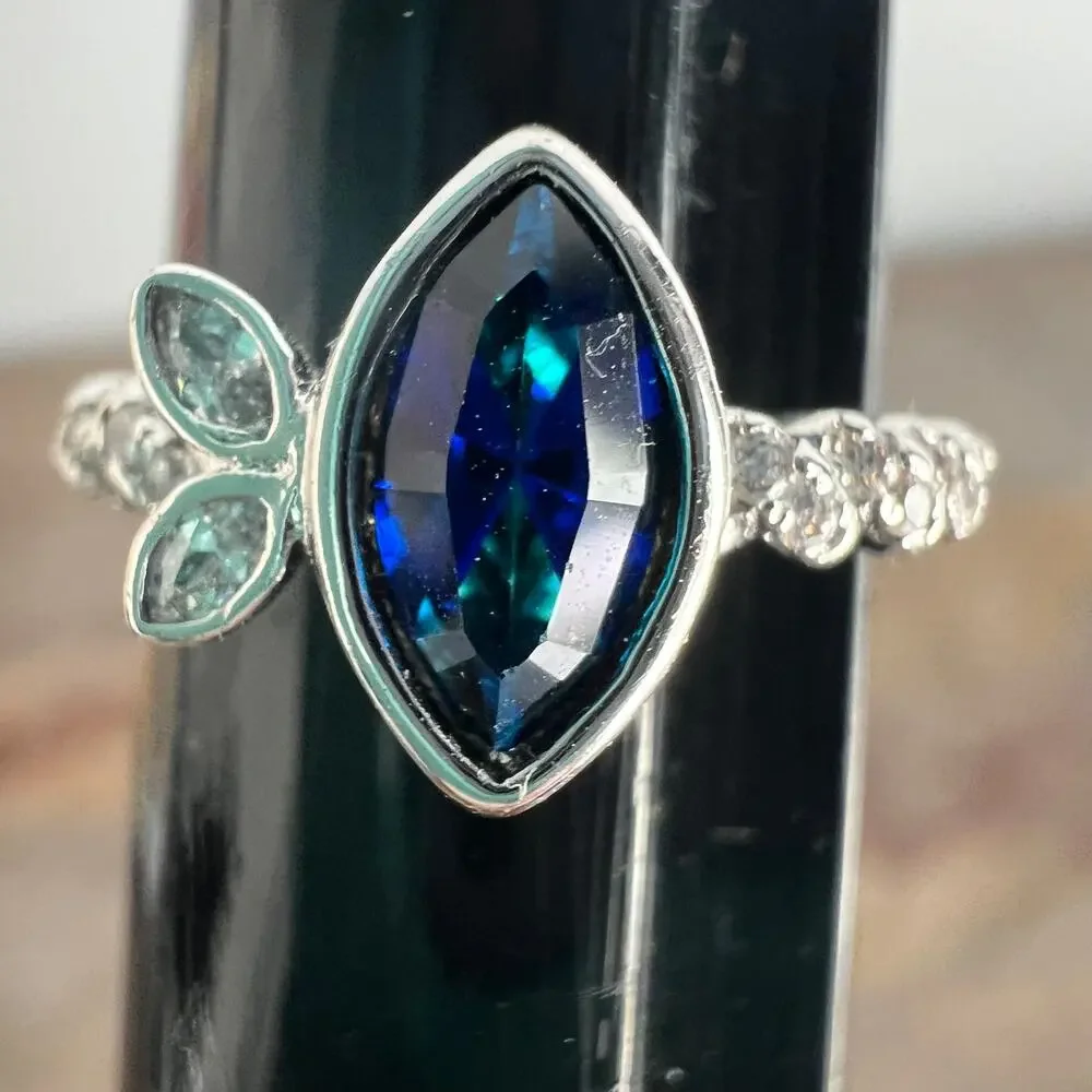 Sapphire blue colored crystal studded elegant ring on silver tone band size 6.25